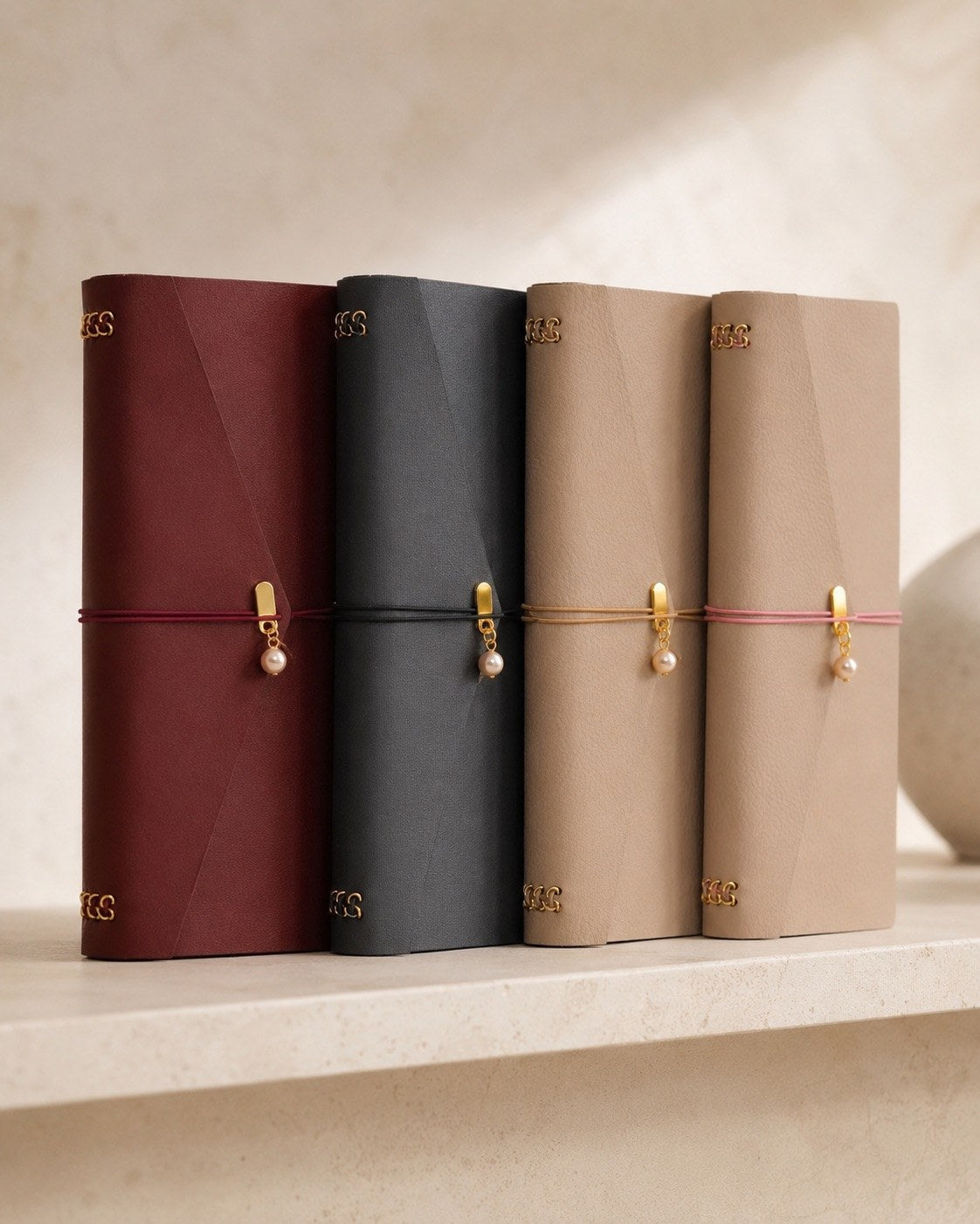 Arrondi Burgundy cover shown with the collection