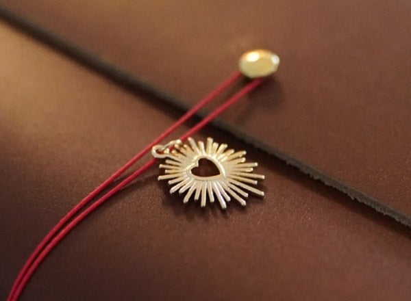 The front closure cord and its charm attachment