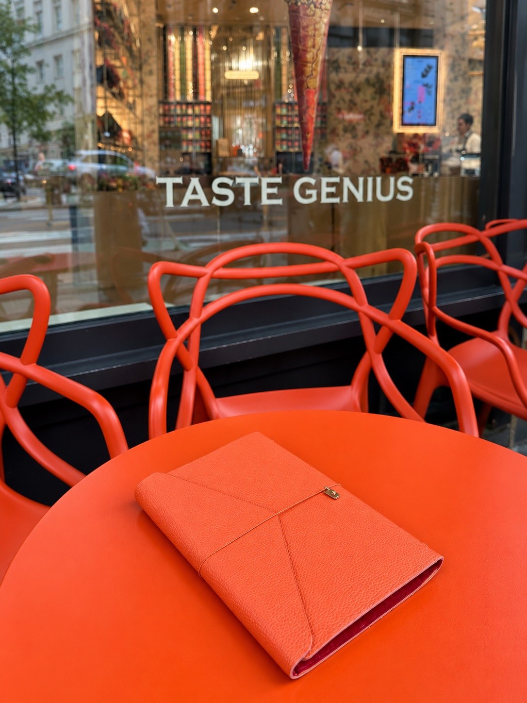 An orange leather cover on a bright café table