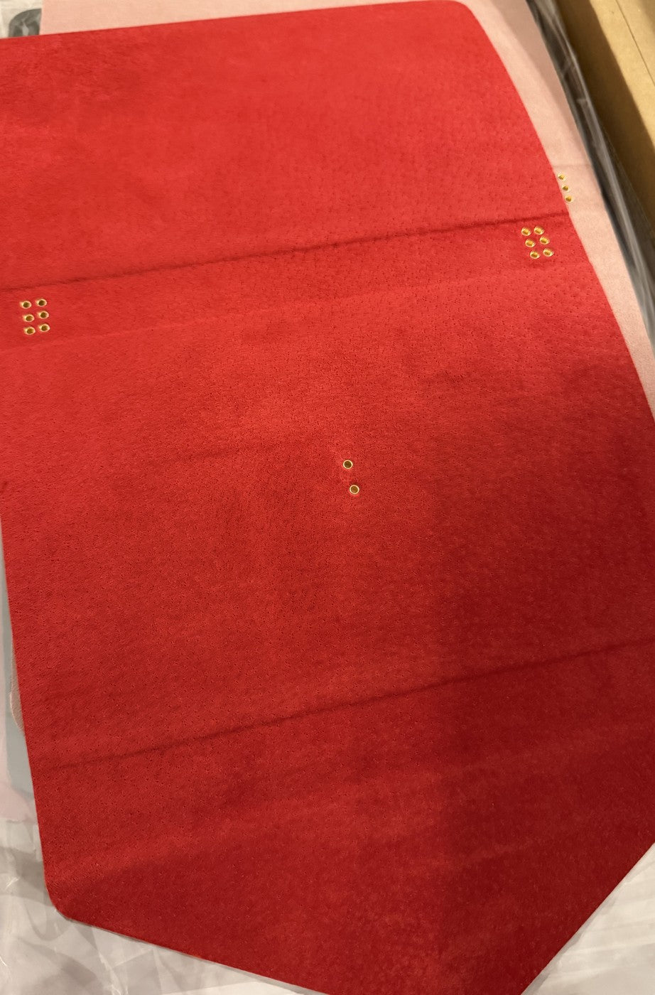 Red interior leather, laid flat before assembly
